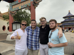 Four students smiling at camera while in foreign country